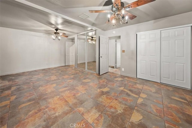 30052 Hunstock St, Castaic, CA 91384 - unfurnished bedroom with baseboards, two closets, ceiling fan, and stone finish flooring