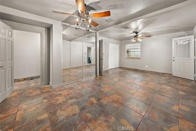 30052 Hunstock St, Castaic, CA 91384 - unfurnished bedroom with baseboards, stone finish flooring, multiple closets, and ceiling fan