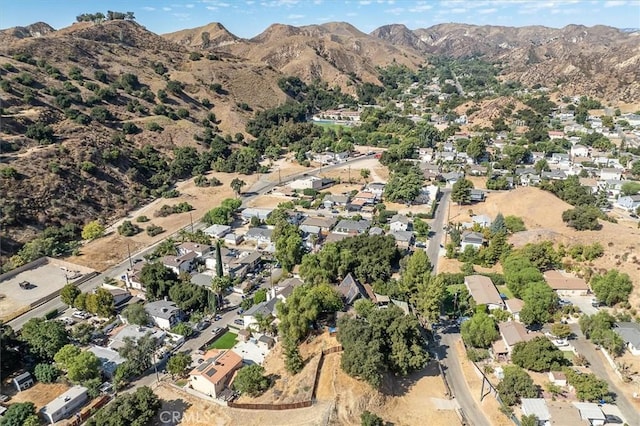 30052 Hunstock St, Castaic, CA 91384 - aerial overview of property's location with a mountain backdrop and nearby suburban area