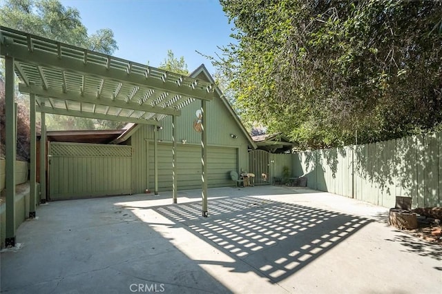 30052 Hunstock St, Castaic, CA 91384 - view of patio / terrace featuring a gate, concrete driveway, and a pergola