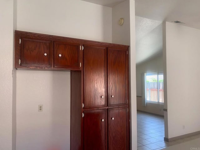 5612 Old Ranch Rd, Oceanside, CA 92057 - interior space with baseboards, visible vents, light tile patterned flooring, and vaulted ceiling