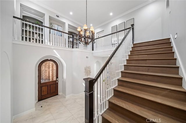 19 Ivanhoe, Irvine, CA 92602 - foyer featuring stairs, a chandelier, marble finish floor, arched walkways, and a towering ceiling