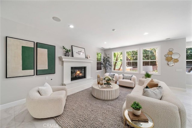 19 Ivanhoe, Irvine, CA 92602 - living room featuring recessed lighting, a glass covered fireplace, marble finish floor, and baseboards