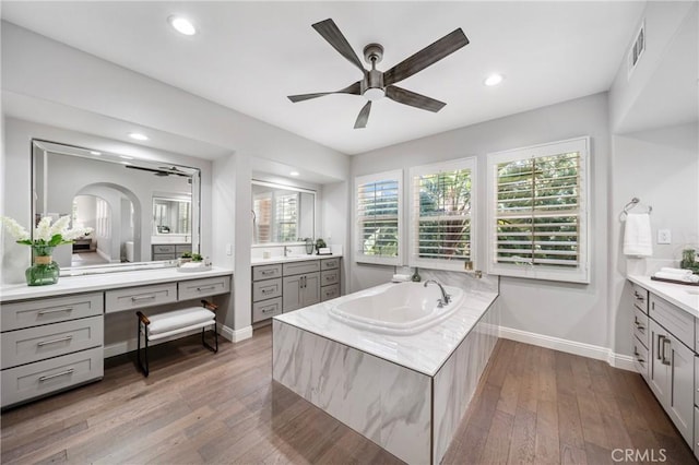 19 Ivanhoe, Irvine, CA 92602 - full bathroom featuring a bath, vanity, a ceiling fan, and baseboards