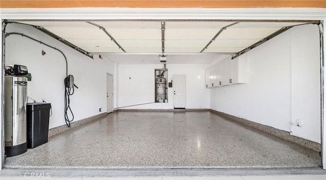 19 Ivanhoe, Irvine, CA 92602 - garage featuring strapped water heater and baseboards
