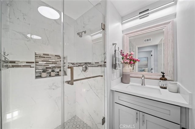 19 Ivanhoe, Irvine, CA 92602 - bathroom with visible vents, vanity, and a marble finish shower