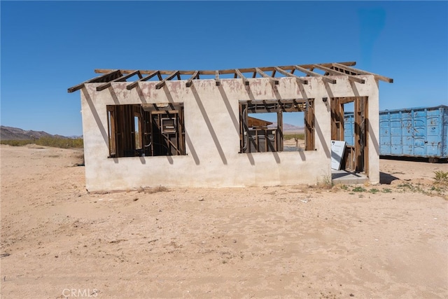 back of house featuring a pergola