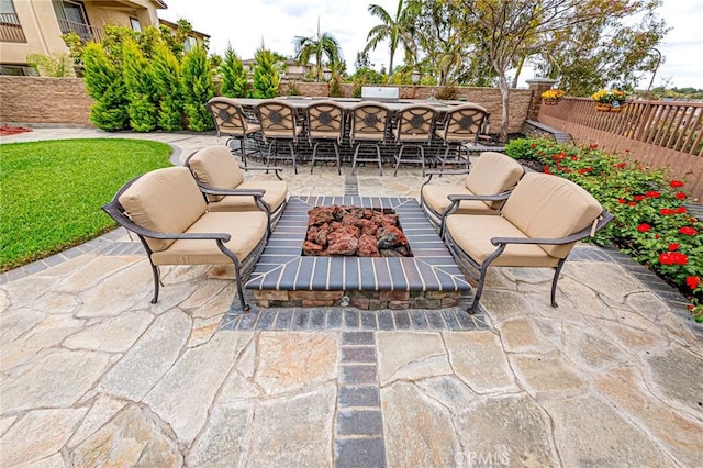 view of patio / terrace with fence and outdoor dry bar