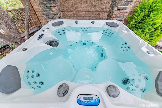 exterior details featuring a jacuzzi