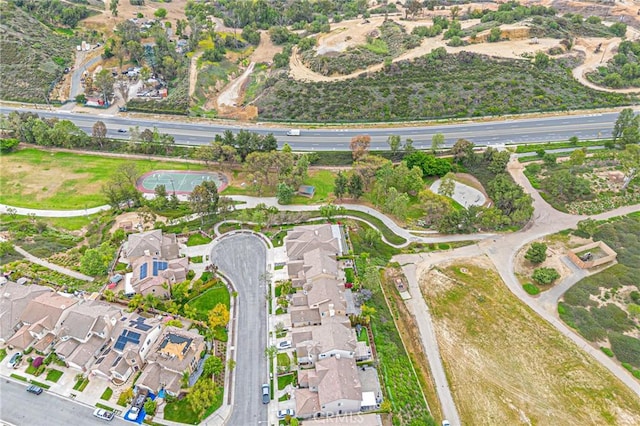 birds eye view of property with a residential view