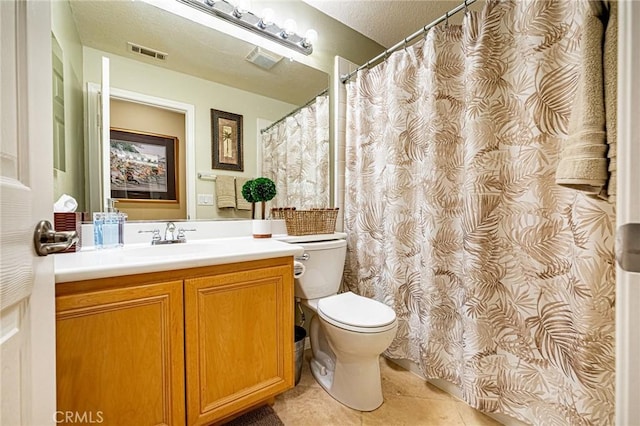 bathroom with toilet, visible vents, tile patterned flooring, and vanity