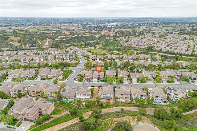 birds eye view of property with a residential view