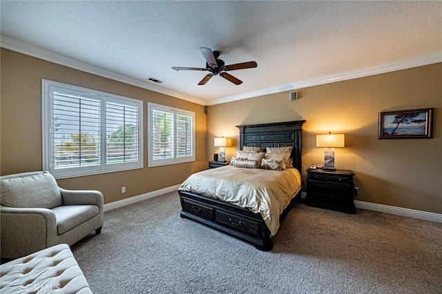 carpeted bedroom featuring crown molding, baseboards, and visible vents