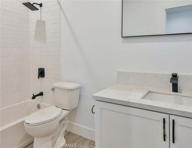 bathroom with toilet, baseboards, shower / washtub combination, wood finished floors, and vanity
