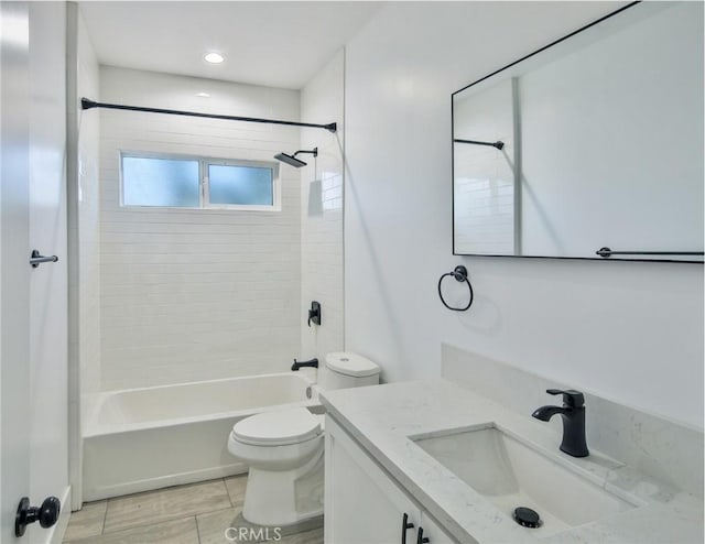 bathroom with toilet, tile patterned floors, vanity, and bathtub / shower combination