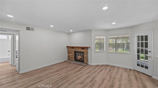 unfurnished living room with baseboards, recessed lighting, light wood-style flooring, and visible vents