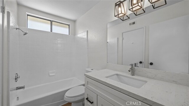 full bathroom featuring vanity, bathtub / shower combination, toilet, and visible vents