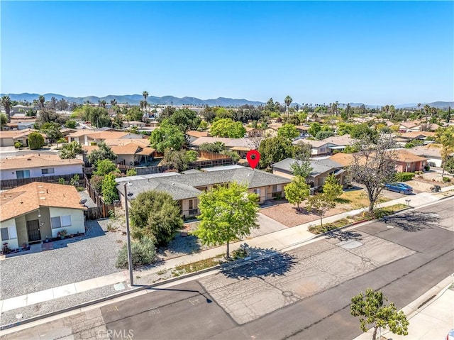 birds eye view of property with a mountain view and a residential view
