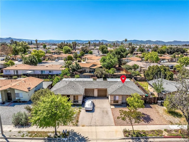 birds eye view of property featuring a mountain view and a residential view