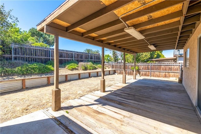 deck with a fenced backyard