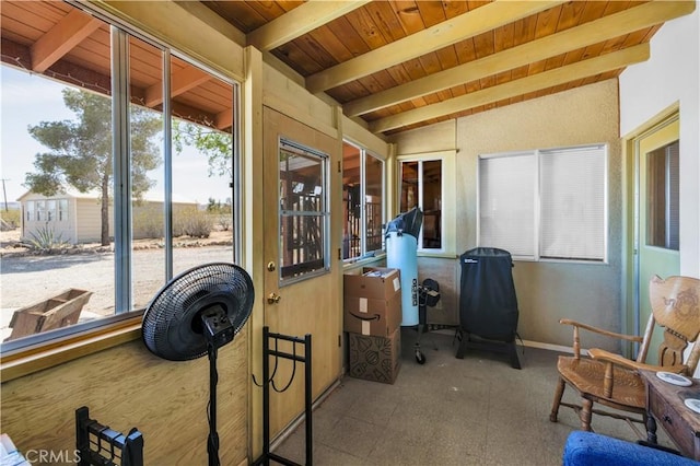 sunroom / solarium with beamed ceiling