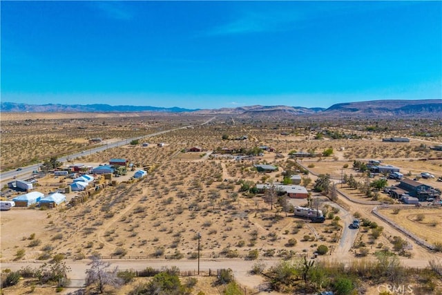 bird's eye view with a mountain view, a rural view, and a desert view