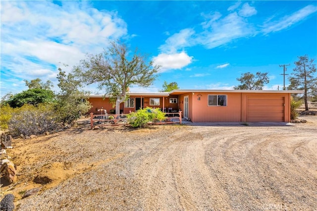 view of front of house featuring driveway and a garage