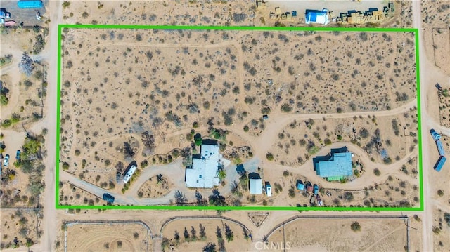 birds eye view of property with a desert view