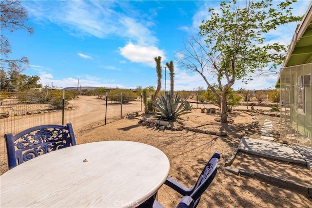 view of patio featuring fence
