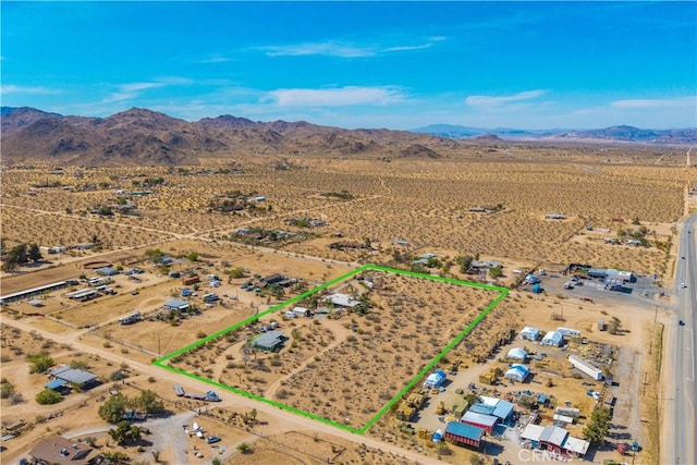 bird's eye view featuring a rural view, a mountain view, and a desert view