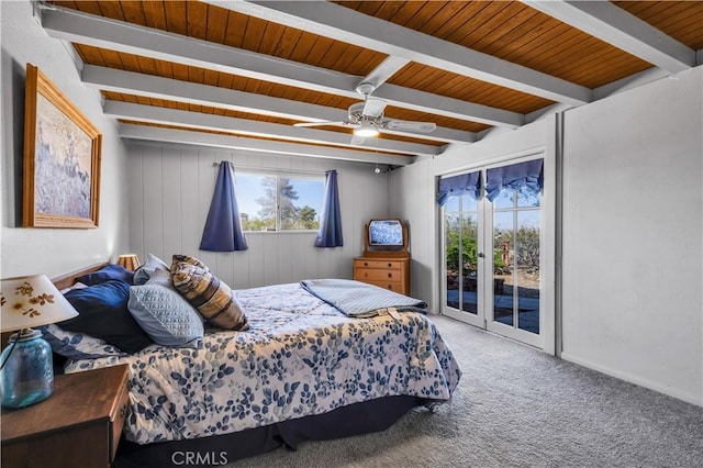 bedroom with wood ceiling, carpet flooring, beamed ceiling, ceiling fan, and access to outside