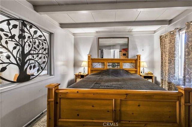 bedroom with beam ceiling