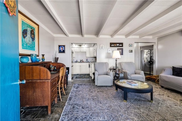 living room featuring beam ceiling