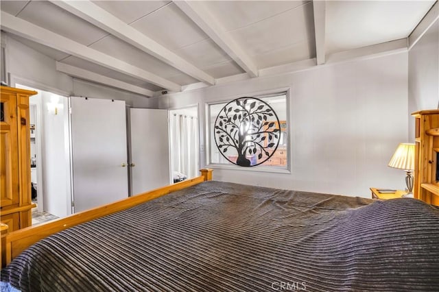bedroom with beam ceiling