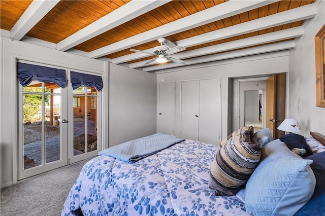 carpeted bedroom with beam ceiling, wooden ceiling, access to exterior, and french doors