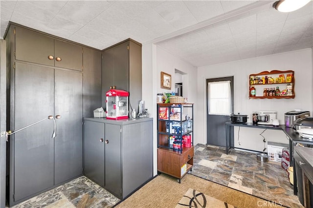 kitchen featuring stone finish floor