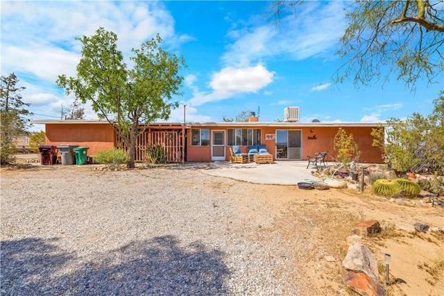back of property featuring a patio