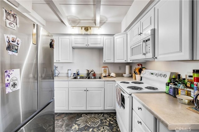 kitchen featuring white cabinetry, beamed ceiling, white appliances, and a sink