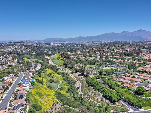 drone / aerial view featuring a mountain view and a residential view