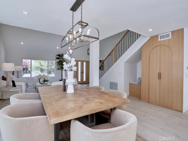 dining space featuring recessed lighting, a chandelier, visible vents, and light wood finished floors