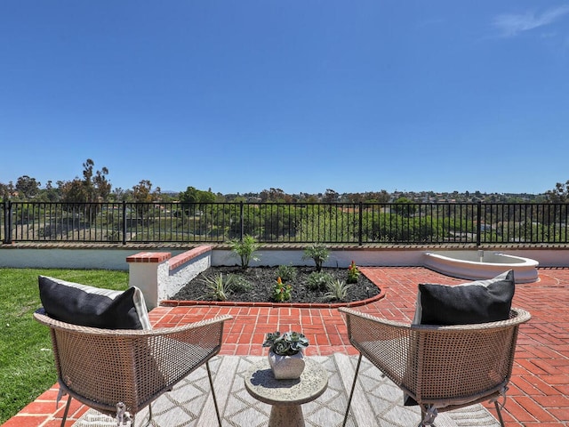 view of patio featuring fence