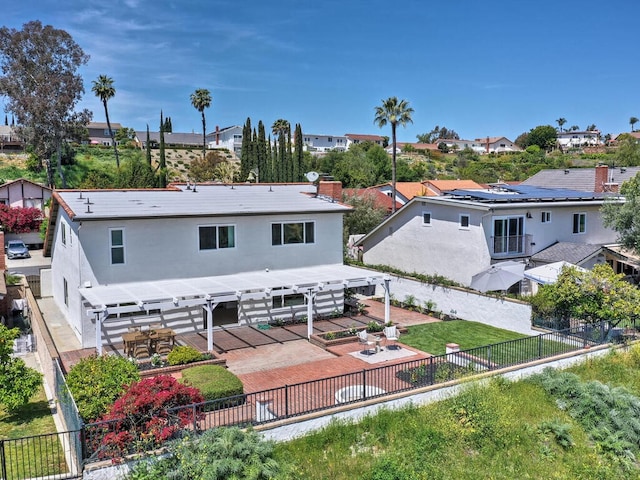 rear view of property with a pergola, a patio area, a residential view, and a fenced backyard