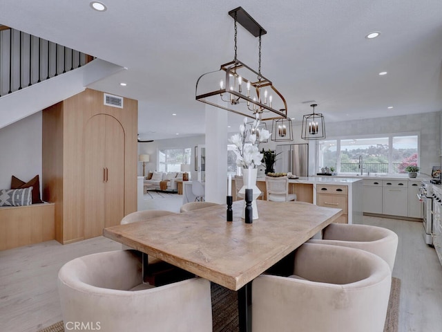 dining room featuring recessed lighting, light wood-type flooring, and visible vents