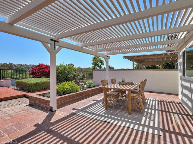 view of patio / terrace with fence, outdoor dining space, and a pergola