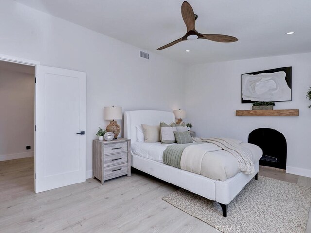 bedroom featuring recessed lighting, light wood-style flooring, visible vents, and baseboards