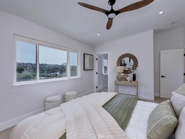 bedroom with baseboards, multiple windows, and recessed lighting