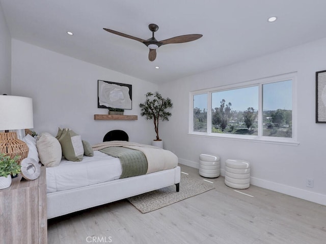 bedroom featuring baseboards, a ceiling fan, wood finished floors, and recessed lighting