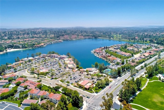 birds eye view of property with a residential view and a water view