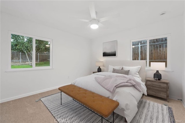bedroom featuring a ceiling fan, carpet, and baseboards
