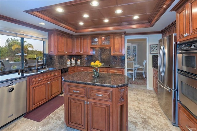 25641 Rapid Falls Rd, Laguna Hills, CA 92653 - kitchen with stainless steel appliances, a sink, a raised ceiling, ornamental molding, and backsplash